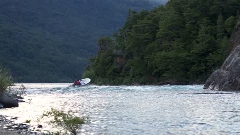 People-on-a-small-boat-in-Puelo-Lake,-Chubut,-Patagonia,-Argentina,-wide-angle-static