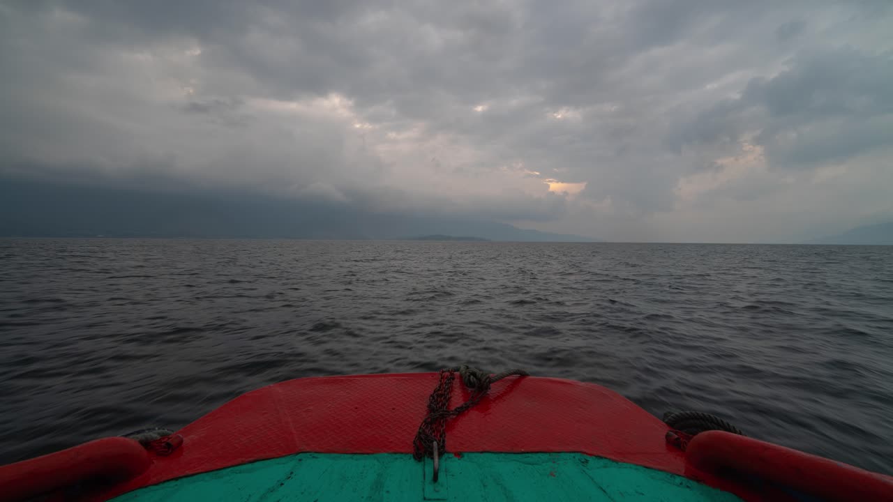 View from the Bow of a Boat on a Cloudy Lake or Sea