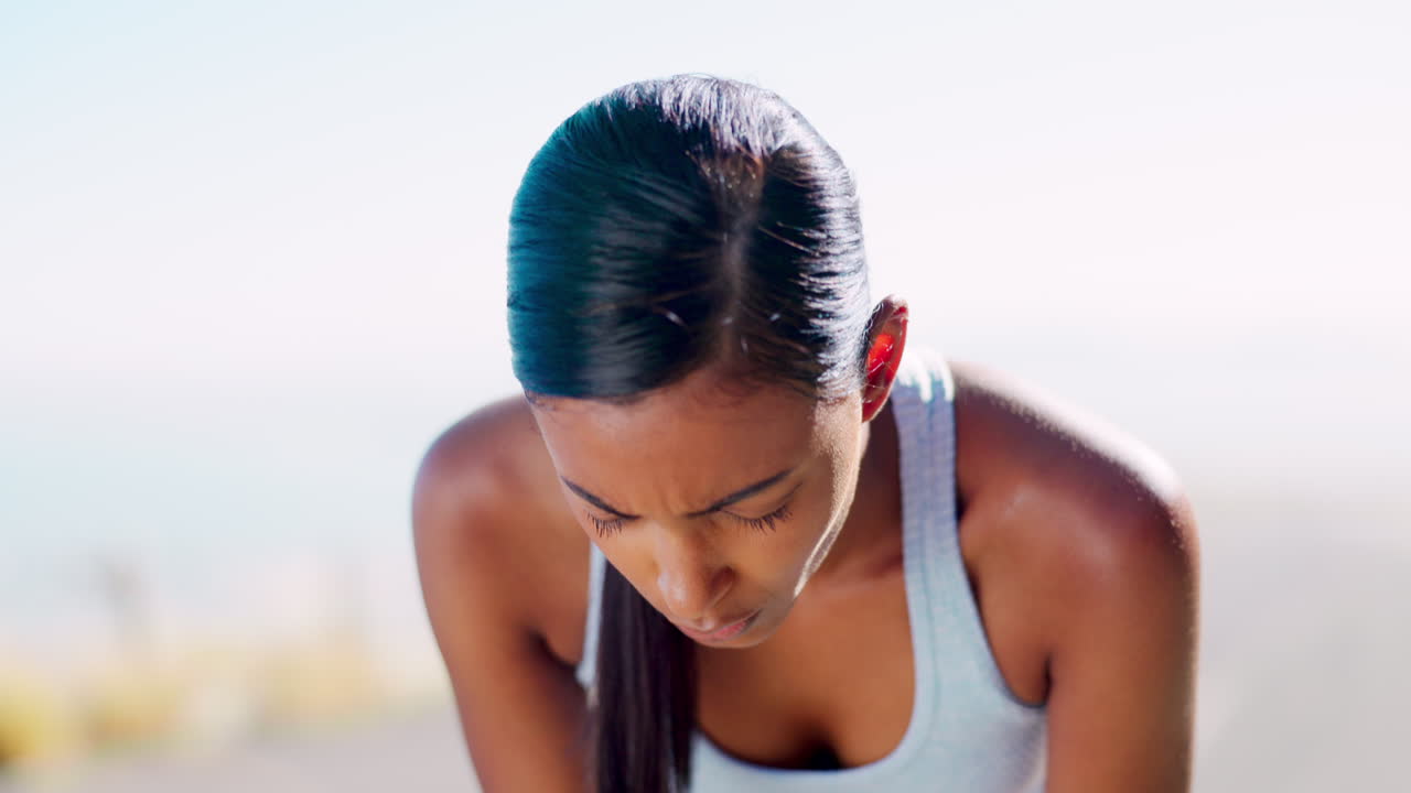 Fitness, tired and Indian woman outdoor