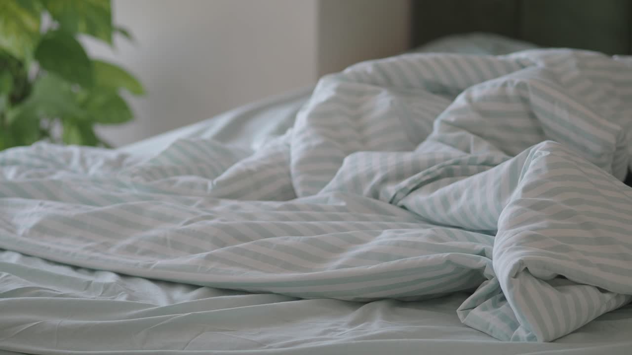 Bed with Striped Sheets