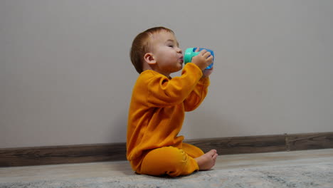 baby drinking from cup