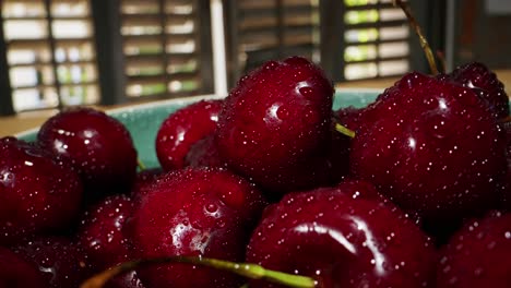 close-up of fresh red cherries with water droplets
