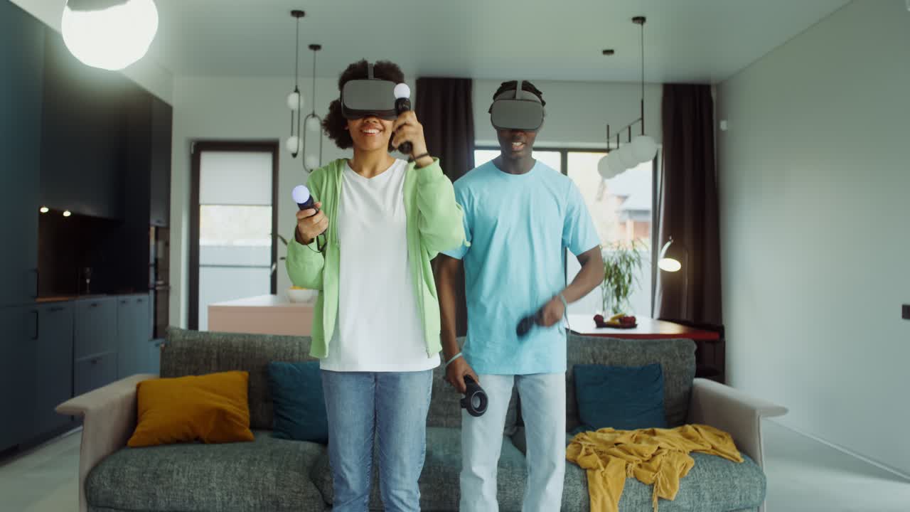 Couple playing VR games at home