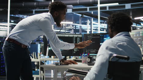 server farm supervisor and man with disability oversee ai analytics
