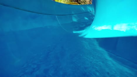 First-person-view,-the-descent-from-the-waterslide-on-holiday