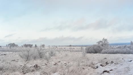 white snow covered landscape time lapse with clouds racing by