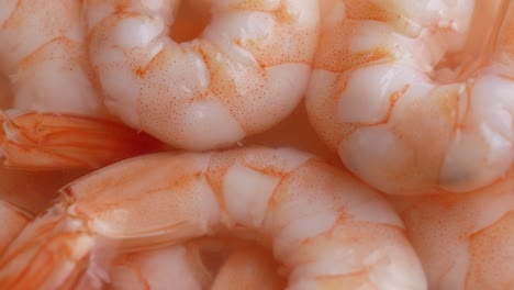 juicy delicious peeled shrimp in sauce, close-up rotate