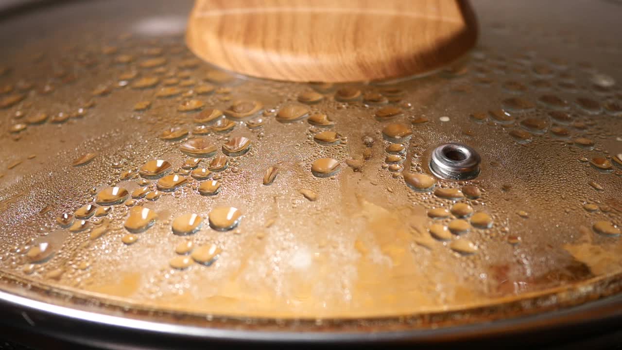 Close-up of a Pan with Lid and Water Droplets
