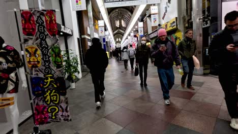 people shopping and walking in kyoto street