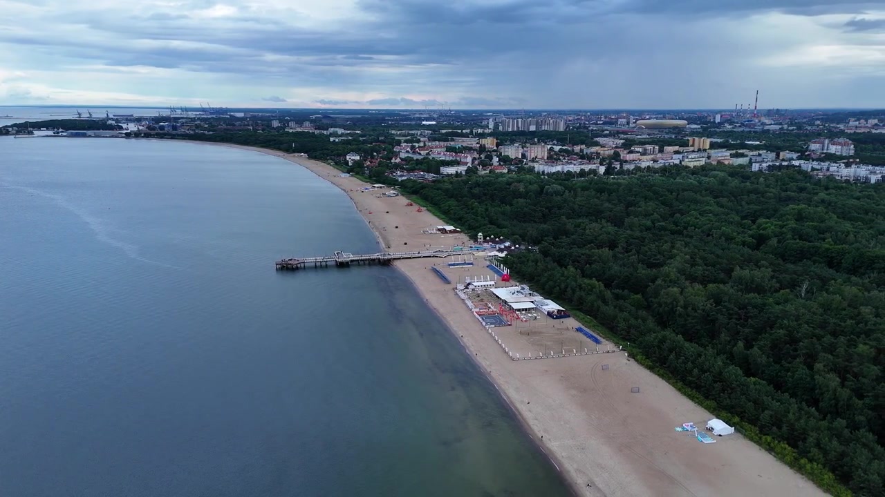 High altitude aerial orbit of Sopot Pier, panoramic view of Bay of Gdańsk, Baltic coast