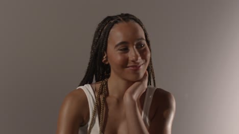 Studio-Beauty-Shot-Of-Young-Woman-With-Long-Braided-Hair-Sitting-At-Table-5