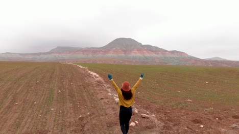 Woman-walk-and-raise-arms-up-at-Nallihan-Bird-Sanctuary