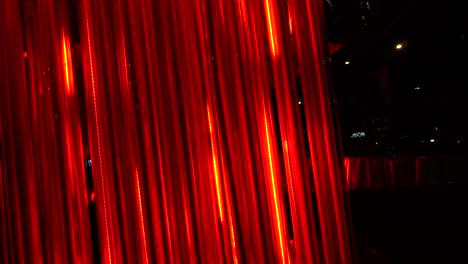 red lights are moving upward into the tubes