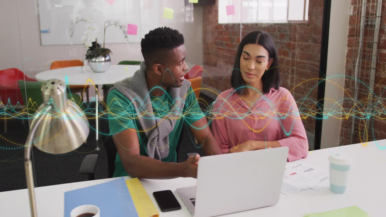Man leaning and clicking trackpad, woman nodding, business review waveform overlay animating