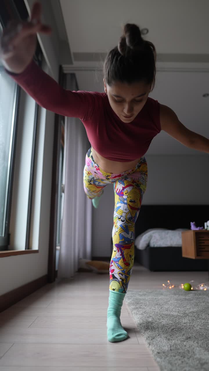 Woman practicing yoga balance pose