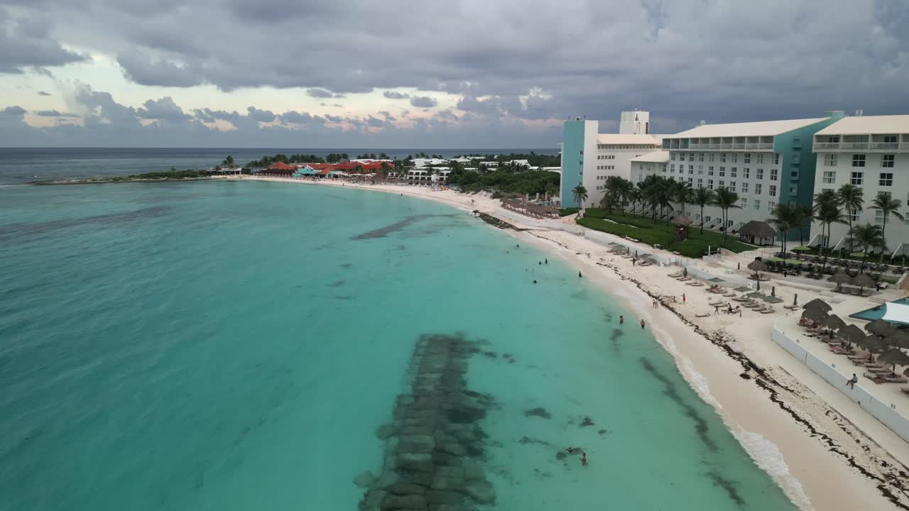 Beautiful Cancun Beach with Clear Blue Waters Along the Coastal Beachfront with Hotels and Resorts Overlooking the Ocean