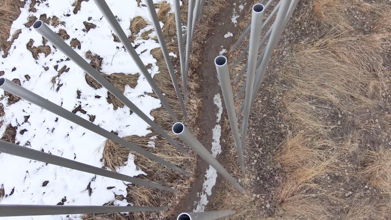 Aluminum tube artwork trail through the tubes.