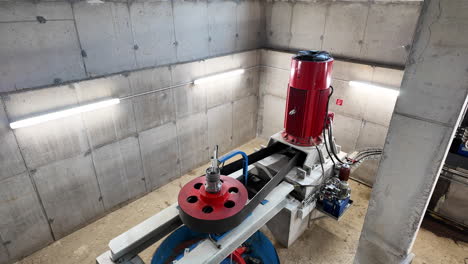 inside hydropower plant with operating turbines