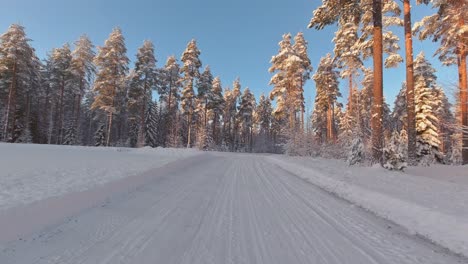 skilled driver pov navigates snow and ice winter forests roads finland