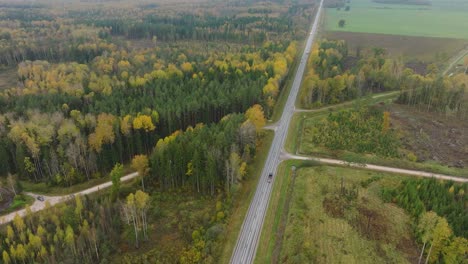 Establishing-aerial-view-of-the-autumn-forest,-yellow-leaves-on-trees,-idyllic-nature-scene-of-leaf-fall,-autumn-morning,-wide-drone-shot-moving-forward,-tilt-down