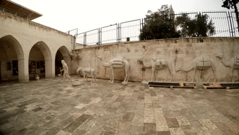 caravan of camels with drover plastic figures in yard of urfa kent museum