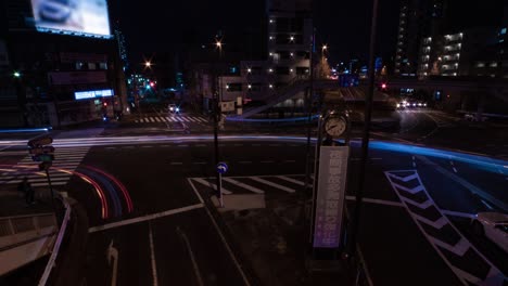 a night timelapse of the traffic jam at the city street in tokyo wide shot