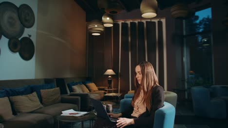 business woman calling video chat online on laptop computer in hotel lobby