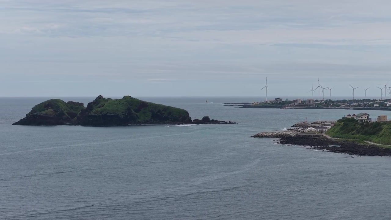 Chagwido Island And Coastal Wind Turbines On Jeju Island, South Korea. - aerial shot
