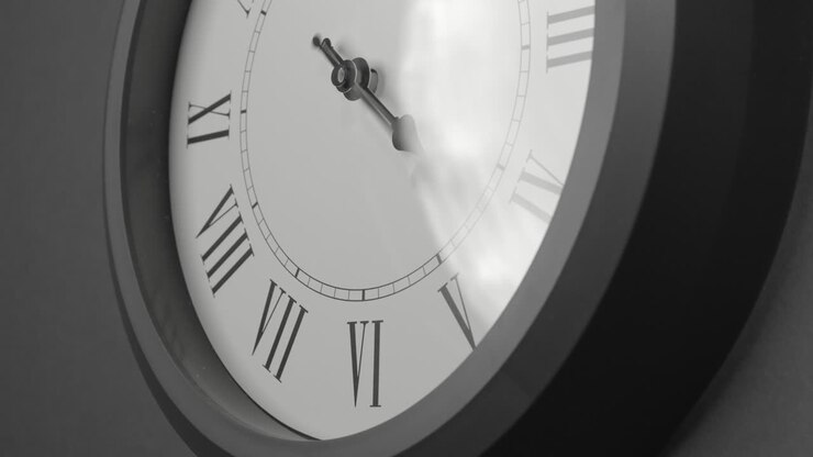 Latin Clock Face in Time Lapse on Dark Grey Wall