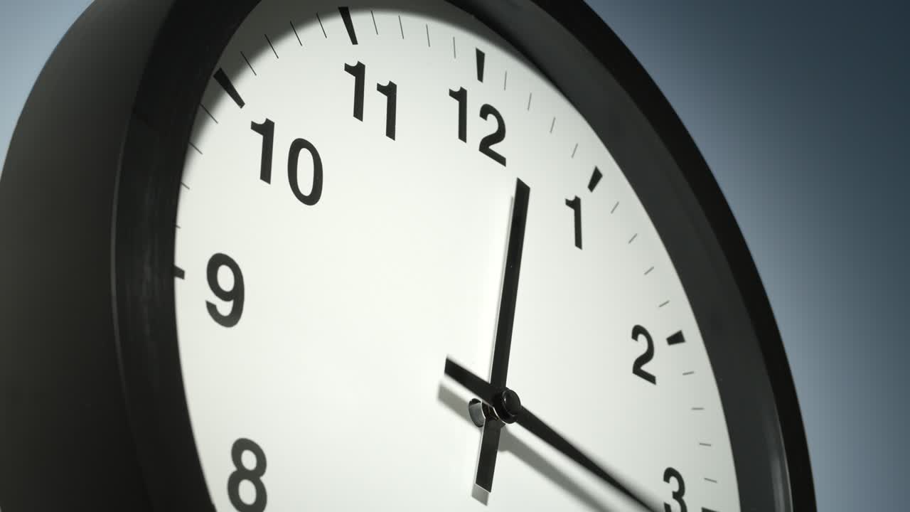 Clock Face on Light Blue Wall in Time Lapse