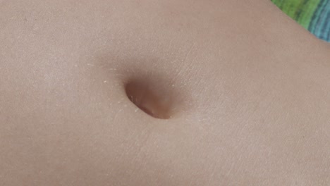 the navel belly button of a woman