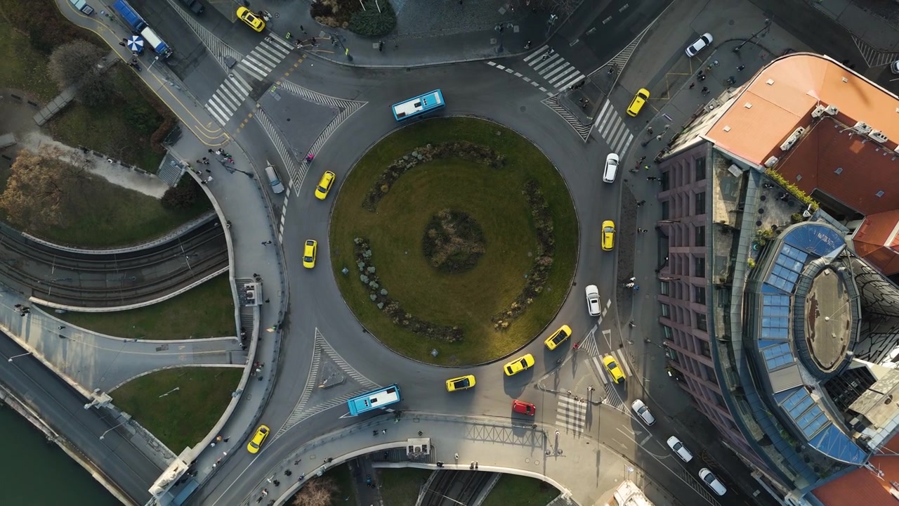 Aerial of Budapest traffic circle with flowing traffic and urban scenery