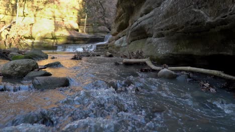 Mountain-river-splashing-and-cascading-down-rocky-steps-in-static-view