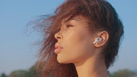 woman with wireless earphones