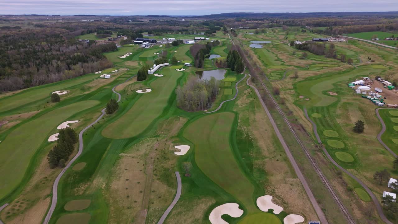 TPC Toronto at Osprey Valley golf course with fairways and trees, cloudy spring day