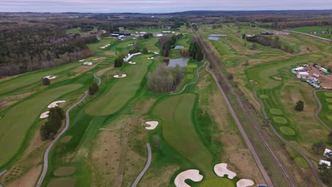 tpc toronto at osprey valley golf course with fairways and trees, cloudy spring day