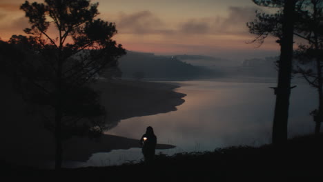 sunrise hike by a misty lake