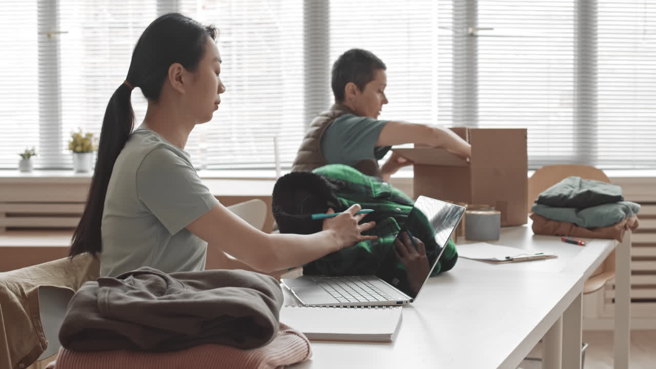 Women Volunteering and Packing Donations