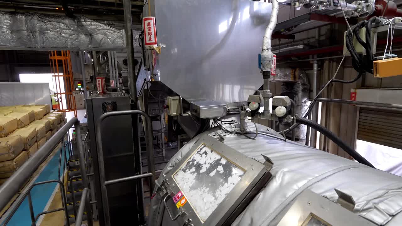 Styrofoam box recycling process. Styrofoam box fragments are washed in the machine. Separation, environmental protection, automated technology concept.