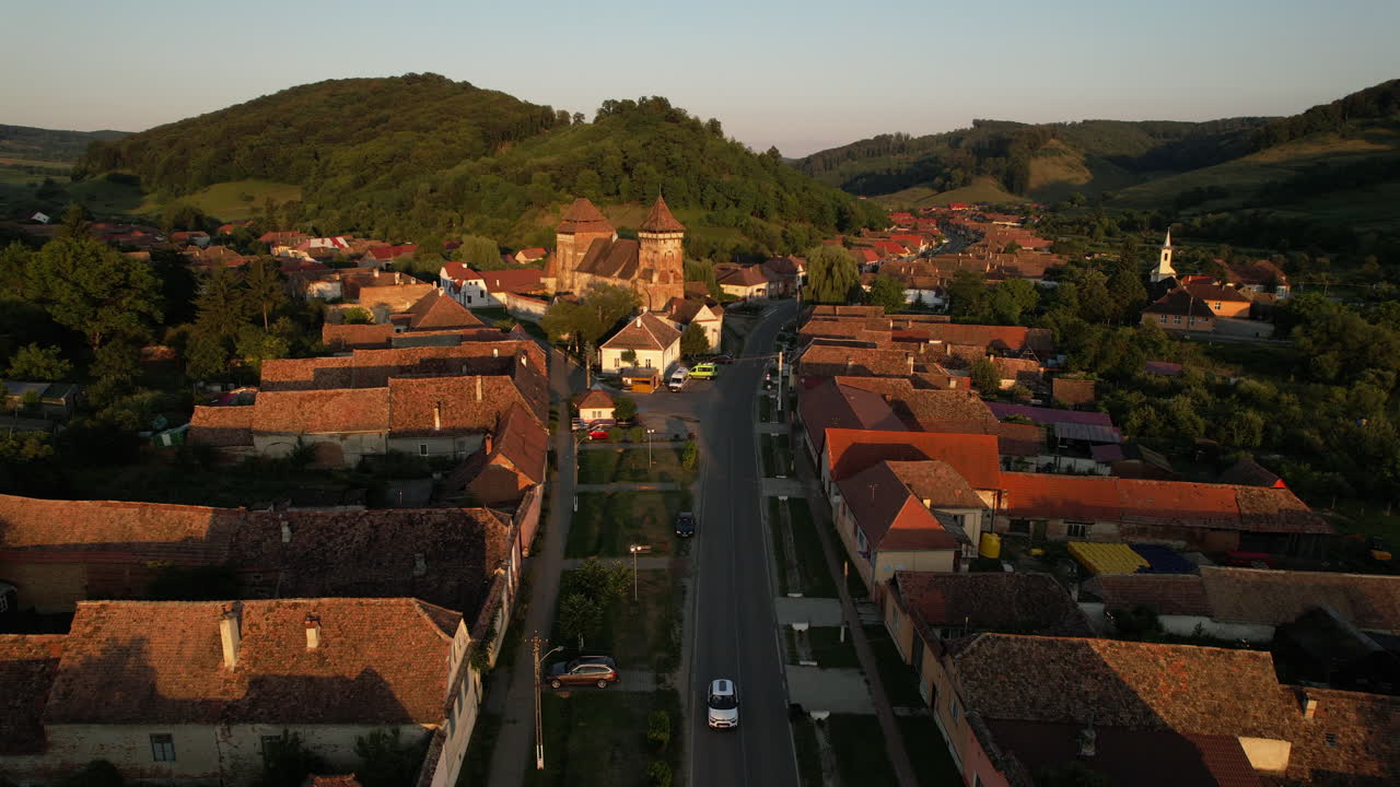 Aerial view of a charming village with a church and traditional architecture