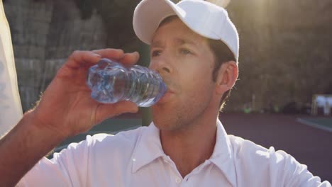 Man-playing-tennis-on-a-sunny-day