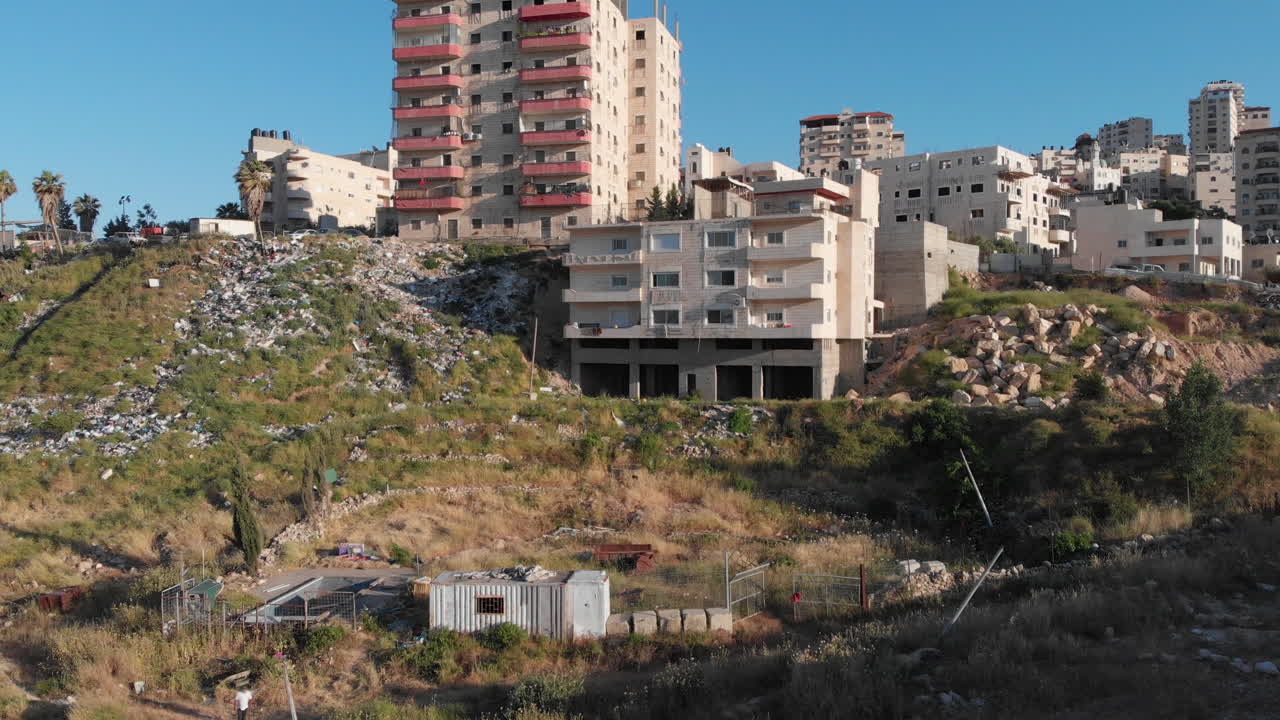 Palestinan town behind security fence in Jerusalem aerial view