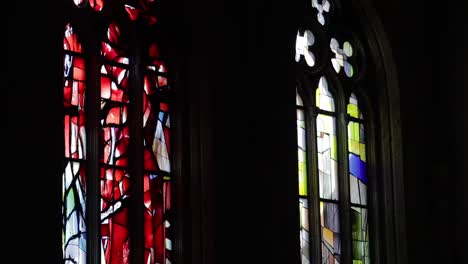 Colourful-stained-glass-windows-light-baroque-Church-of-Gesu-Nuovo,-Naples-Italy