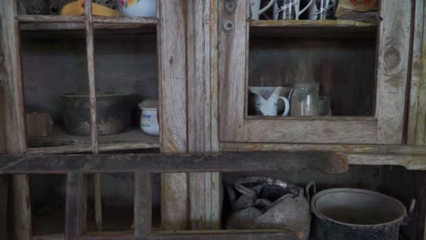 the cupboard contains damaged household items due to a volcanic eruption disaster