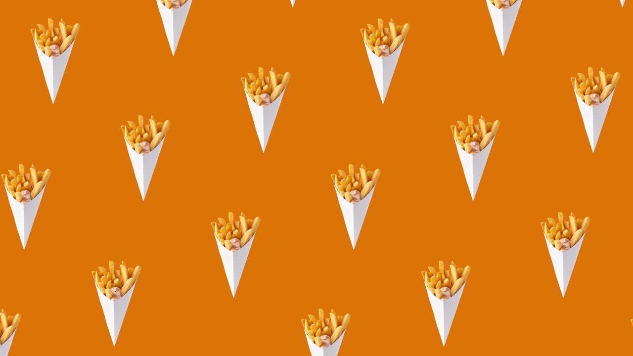 Crisp deep-fried golden potato chips, french fries and sauce on orange background. concept of fast food for advertising, copy space. seamless looping pattern animation