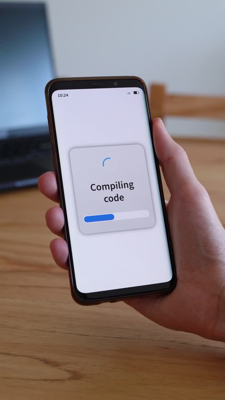 Concept of software development on smartphone. Compiling code screen. Vertical shot