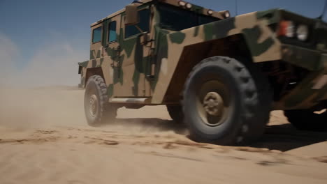 military vehicle in desert sand dunes