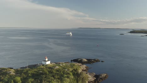 up and to the right of lighthouse with ferry in background