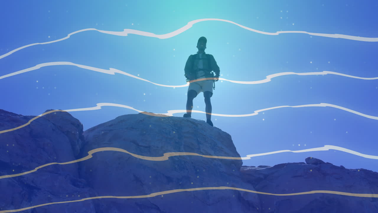 Silhouette of person standing on rocky peak with abstract blue wave animation