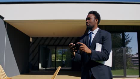 real estate agent taking photos of modern home